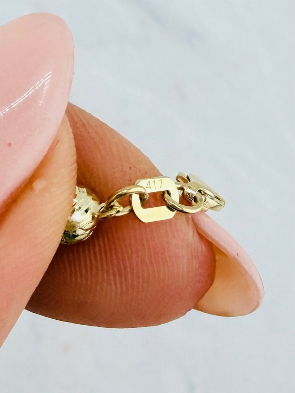 10K gold bracelet features two intertwined hearts 7" - Picture 3 of 6